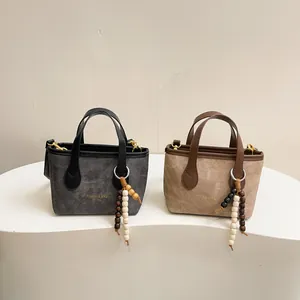 Retro mini tote bags in grey and beige with leather handles and pearl charms