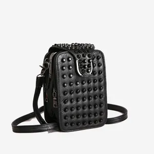 Black punk style rivet crossbody bag with silver horseshoe buckle and pebbled leather
