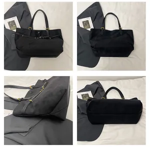 Detail view of large black suede tote bag with gold hardware and multiple angle displays