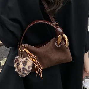 Vintage brown suede pillow handbag with golden metal ring and leopard heart charm