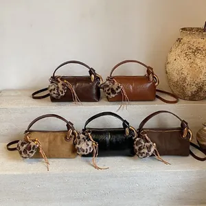 Retro pillow crossbody bags in assorted colors and textures with leopard heart charms
