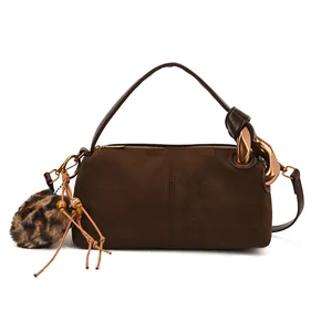 Retro dark brown frosted leather pillow bag with leopard plush charm and chain detail