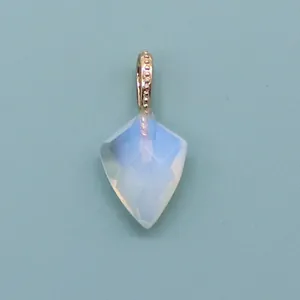 Macro view of faceted shield-shaped moonstone pendant with detailed golden beaded bail