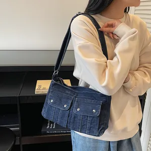 Retro denim shoulder bag in dark blue with cargo pockets for casual daily commute