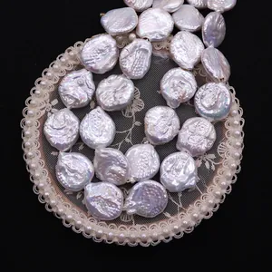 Natural baroque freshwater pearls in white luster on lace tray for DIY jewelry making