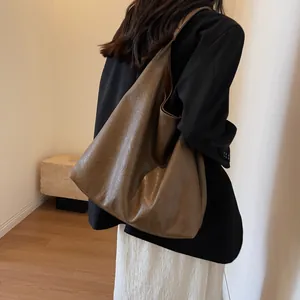 Vintage large brown leather tote bag for women showing a stylish side view with model
