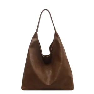 Minimalist large brown hobo tote bag with premium leather texture and slouchy design