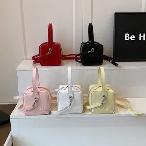 Mini square cube handbags in five colors made of glossy patent leather with silver hardware