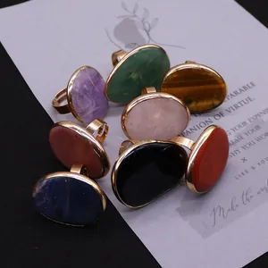 Assorted natural stone adjustable rings featuring amethyst and rose quartz in gold finish