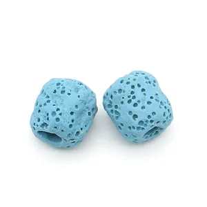 Macro shot of light blue cylindrical volcanic lava stone beads for DIY jewelry making