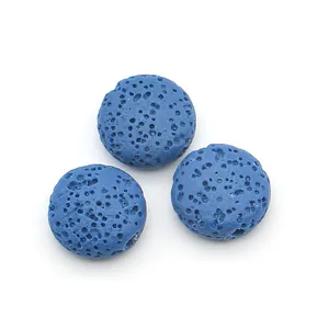 Macro detail of three blue porous lava stone beads for DIY jewelry making