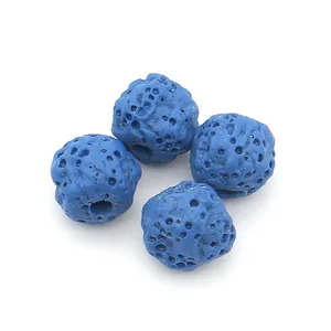 Close-up of blue porous lava stone round beads with natural honeycomb texture for DIY jewelry