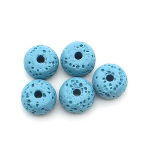 Macro view of five sky blue porous lava stone beads for jewelry DIY projects