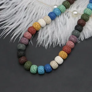 Colorful volcanic lava rock cylinder beads for DIY jewelry making on black background