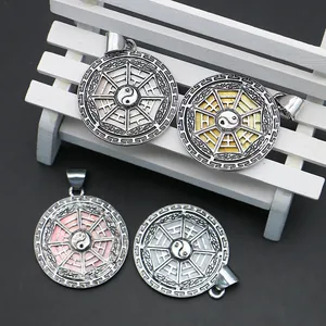Retro Tai Chi Bagua shell pendants in four colors displayed on a wooden stand