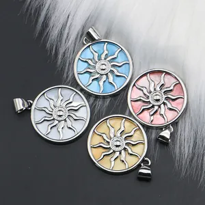 Set of four round sun totem pendants with colorful shell inlays for DIY necklaces