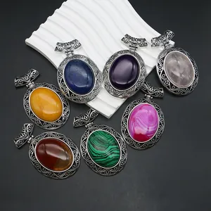 Set of seven vintage oval natural agate stone pendants with hollow floral zinc alloy frames