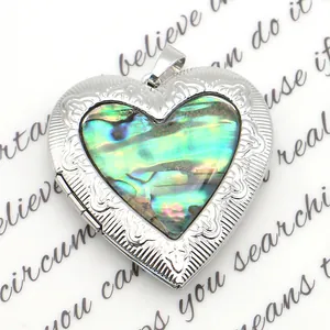 Vintage heart shaped locket pendant with abalone shell and engraved metal details