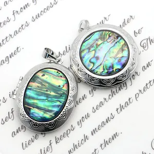 Oval and round locket pendants with iridescent abalone shell and vintage metal floral relief