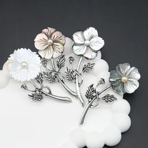 French shell flower brooches with natural pearls and vintage silver metal leaves