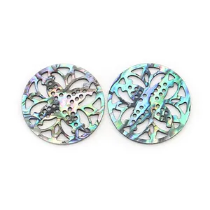 Detail showing natural abalone shell hollow carvings with iridescent floral patterns