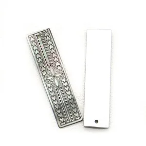 Detailed front and back view of engraved black shell rectangular pendant jewelry sets