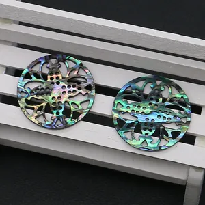 Natural abalone shell turtle-shaped round pendant with intricate hollow-out carving design