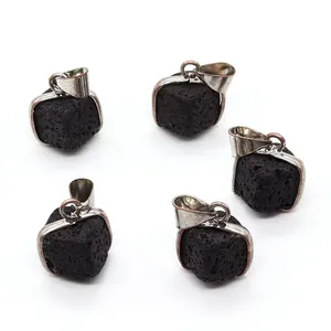 Macro detail of five square black lava stone pendants with silver-plated frames and edges