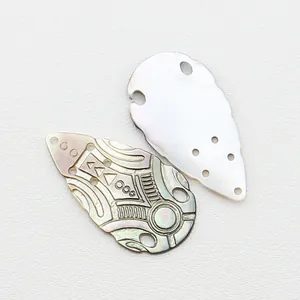 Natural black shell fan-shaped pendants with geometric carvings and pearlescent luster