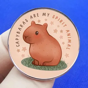 Cute Capybara Spirit Animal round metal badge accessory with hand-drawn art on a blue background