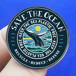 Save the Ocean enamel pin featuring a blue whale design and eco-friendly slogans