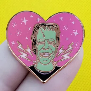 Classic Frankenstein monster heart-shaped enamel pin badge with golden metal edges