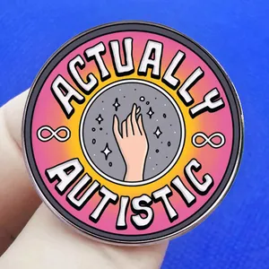 Actually Autistic enamel pin with hand reaching for stars and infinity symbols