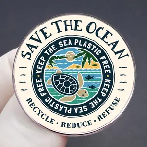 Save the Ocean enamel pin featuring a sea turtle and eco-friendly slogans on metal badge