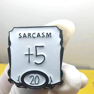 Sarcasm +5 Dungeons and Dragons style enamel pin in white and black for backpacks