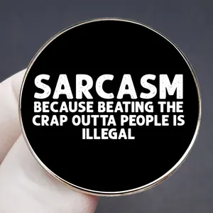 Sarcastic black round pin badge with white text Sarcasm Because Beating The Crap Is Illegal