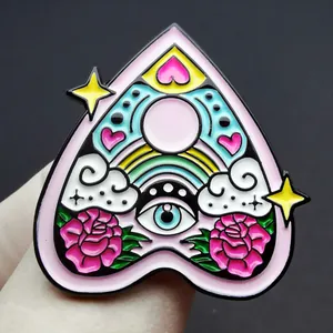 Enamel heart planchette pin with rainbow, mystic eye, and pink roses detail