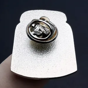 Silver metal vegan enamel pin with matte texture back and butterfly clutch