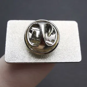Detailed back view of a metal pronoun pin featuring a secure silver butterfly clutch