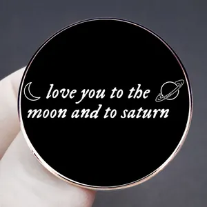 Enamel brooch with gold Saturn and moon motifs and Love You to the Moon and Saturn text