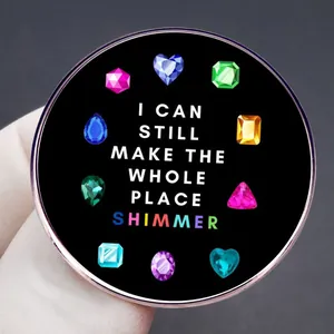 Taylor lyric brooch featuring I Can Still Make The Whole Place Shimmer with colorful gems