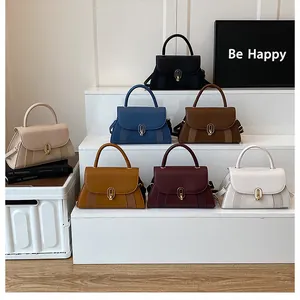 Collection of chic handbags in diverse colors featuring oval metal clasps and woven details