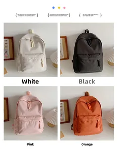 Detail view of simple canvas backpacks in white, black, pink and orange color options
