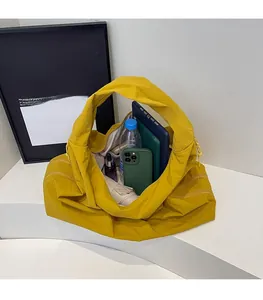 Internal view showing spacious storage capacity of this bright yellow nylon tote bag