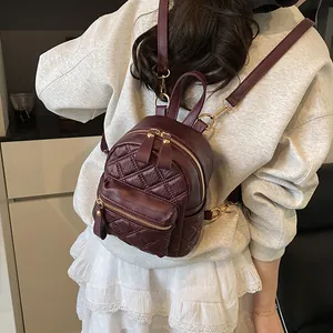 Chic burgundy quilted mini backpack with gold zippers for women, stylish everyday rucksack