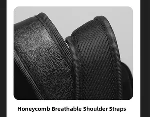 Detail of breathable honeycomb mesh shoulder straps on a black business laptop backpack