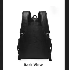 Rear view of black lychee leather backpack showing padded straps and ergonomic design