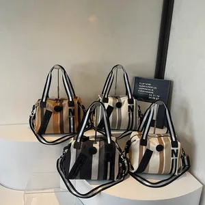Striped canvas Boston shoulder bags with N patch and adjustable straps in four colors