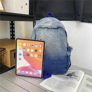 Sac à dos en jean délavé dégradé bleu pour femme avec une tablette en référence