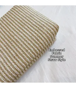 Macro detail of summer straw woven fabric texture with beige and light brown patterns